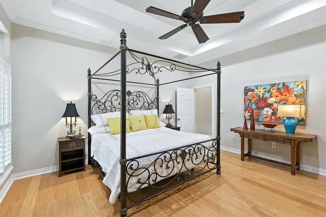 a bedroom with a bed next to a window