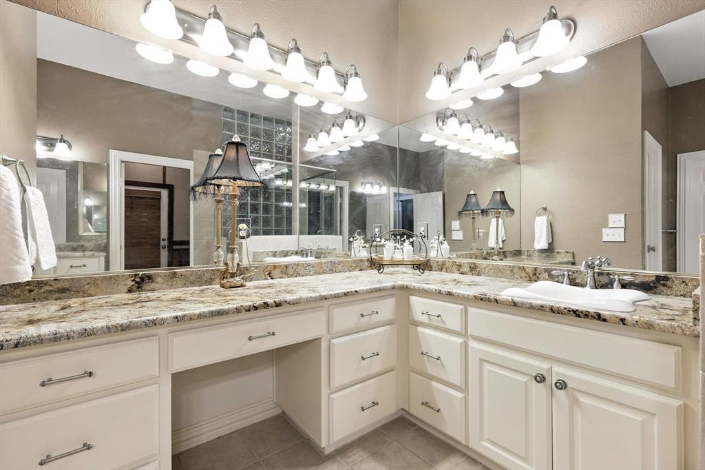 109 Visalia Lane Denton, TX 76210 - Photo 14 of 36 a bathroom with a sink vanity and a mirror