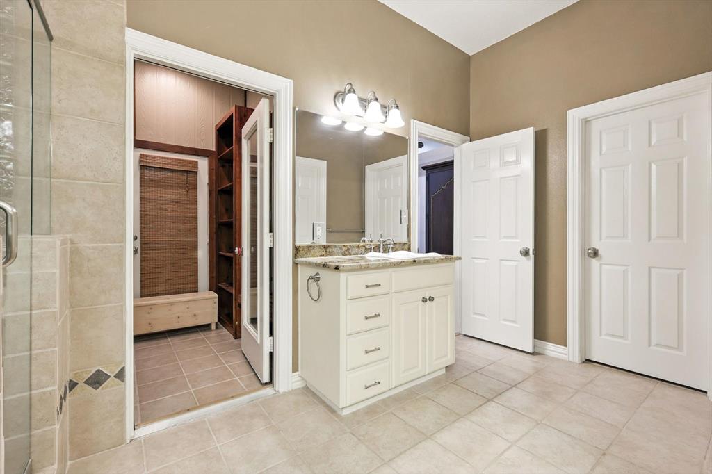 109 Visalia Lane Denton, TX 76210 - Photo 15 of 36 a bathroom with a double vanity sink mirror and shower