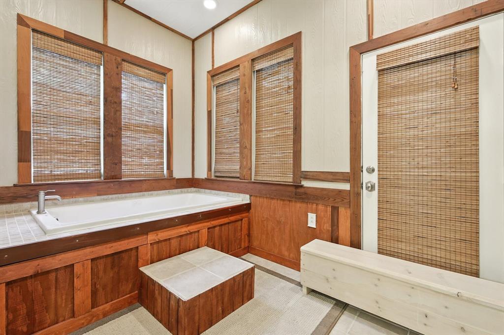 109 Visalia Lane Denton, TX 76210 - Photo 16 of 36 a bathroom with a tub sink and mirror