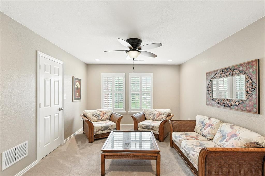 109 Visalia Lane Denton, TX 76210 - Photo 19 of 36 a living room with furniture and a large window