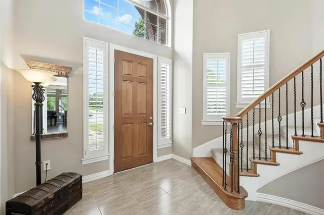 a view of a livingroom with a furniture and staircase