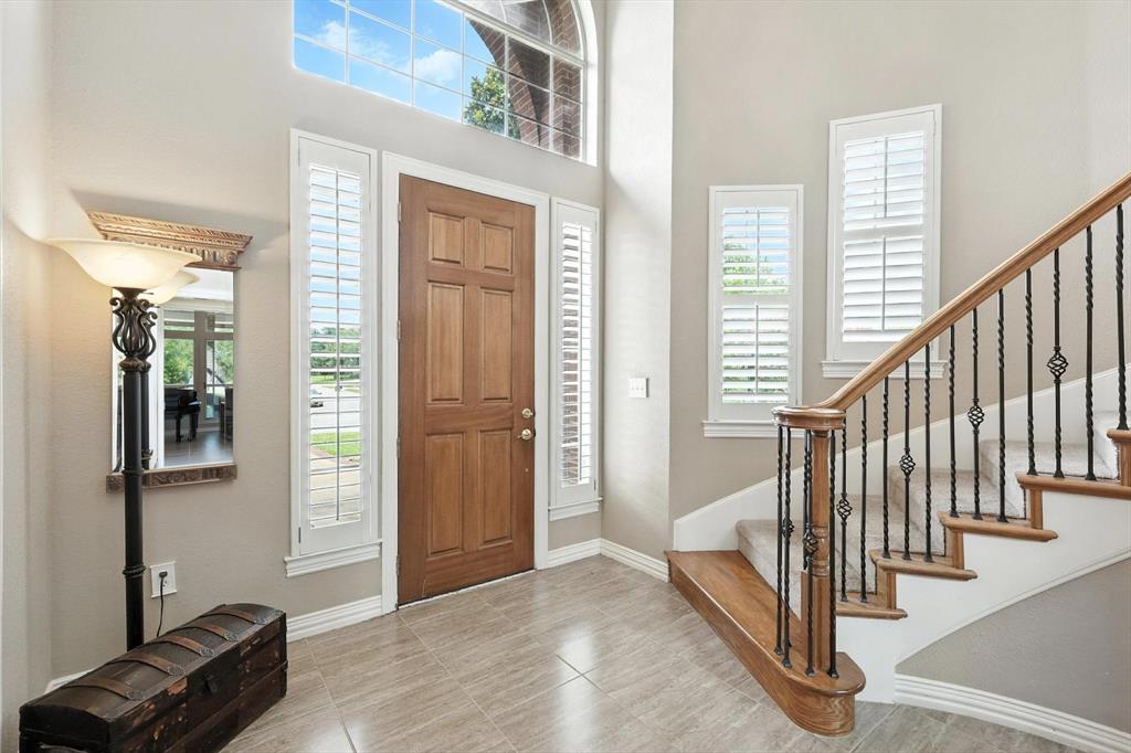 109 Visalia Lane Denton, TX 76210 - Photo 2 of 36 a view of a livingroom with a furniture and staircase