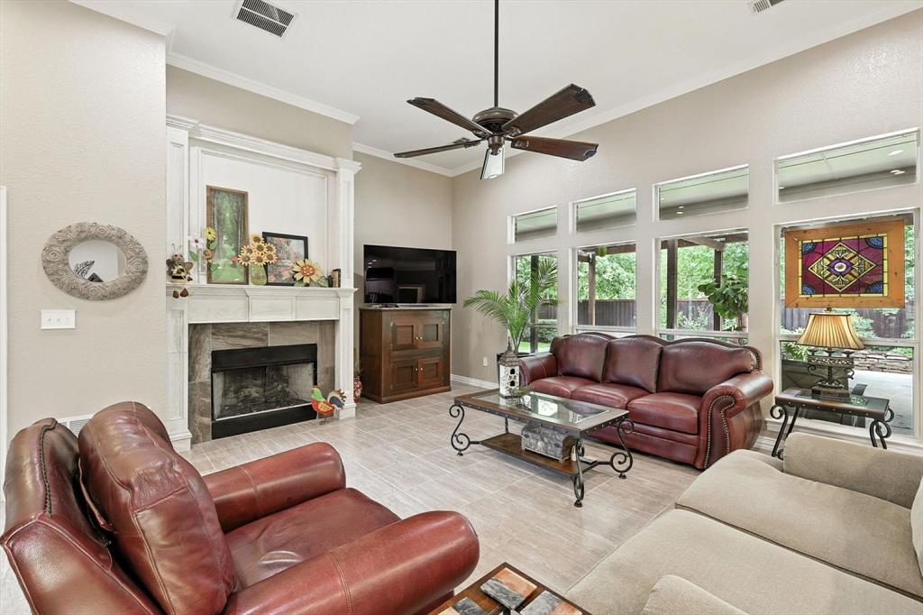 109 Visalia Lane Denton, TX 76210 - Photo 4 of 36 a living room with furniture a fireplace and a window