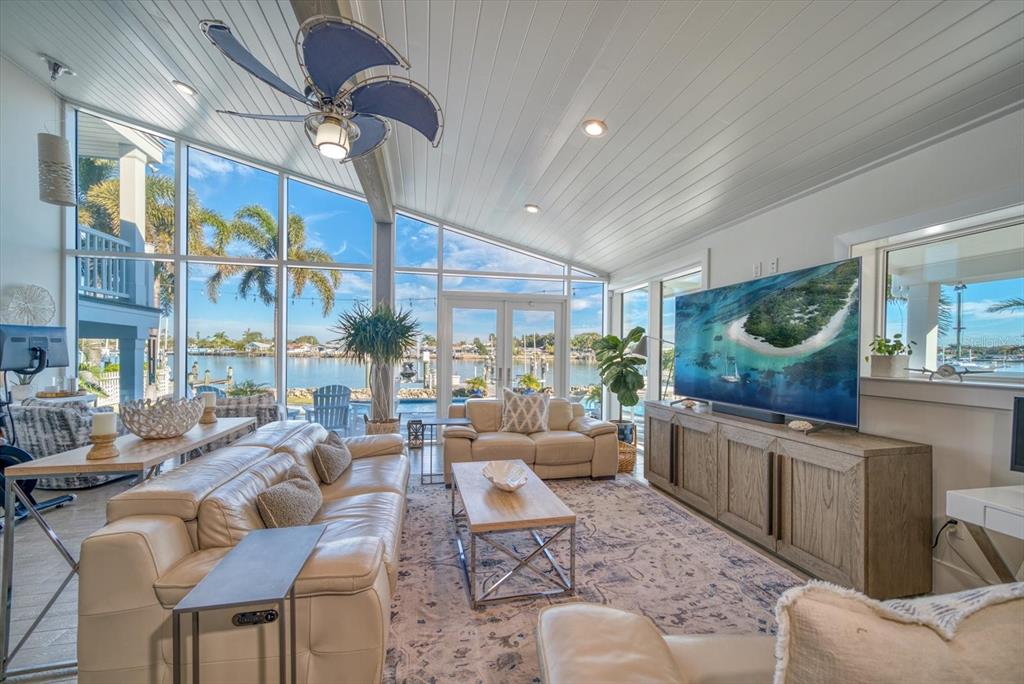 478 20th Avenue Indian Rocks Beach, FL 33785 - Photo 11 of 80 Family room with floor to ceiling impact rated windows