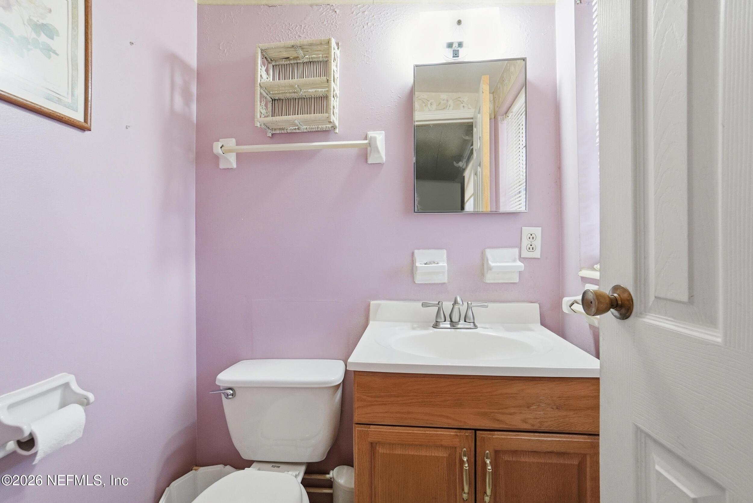43 Forrestal Circle North Atlantic Beach, FL 32233 - Photo 21 of 39 a bathroom with a sink mirror and toilet