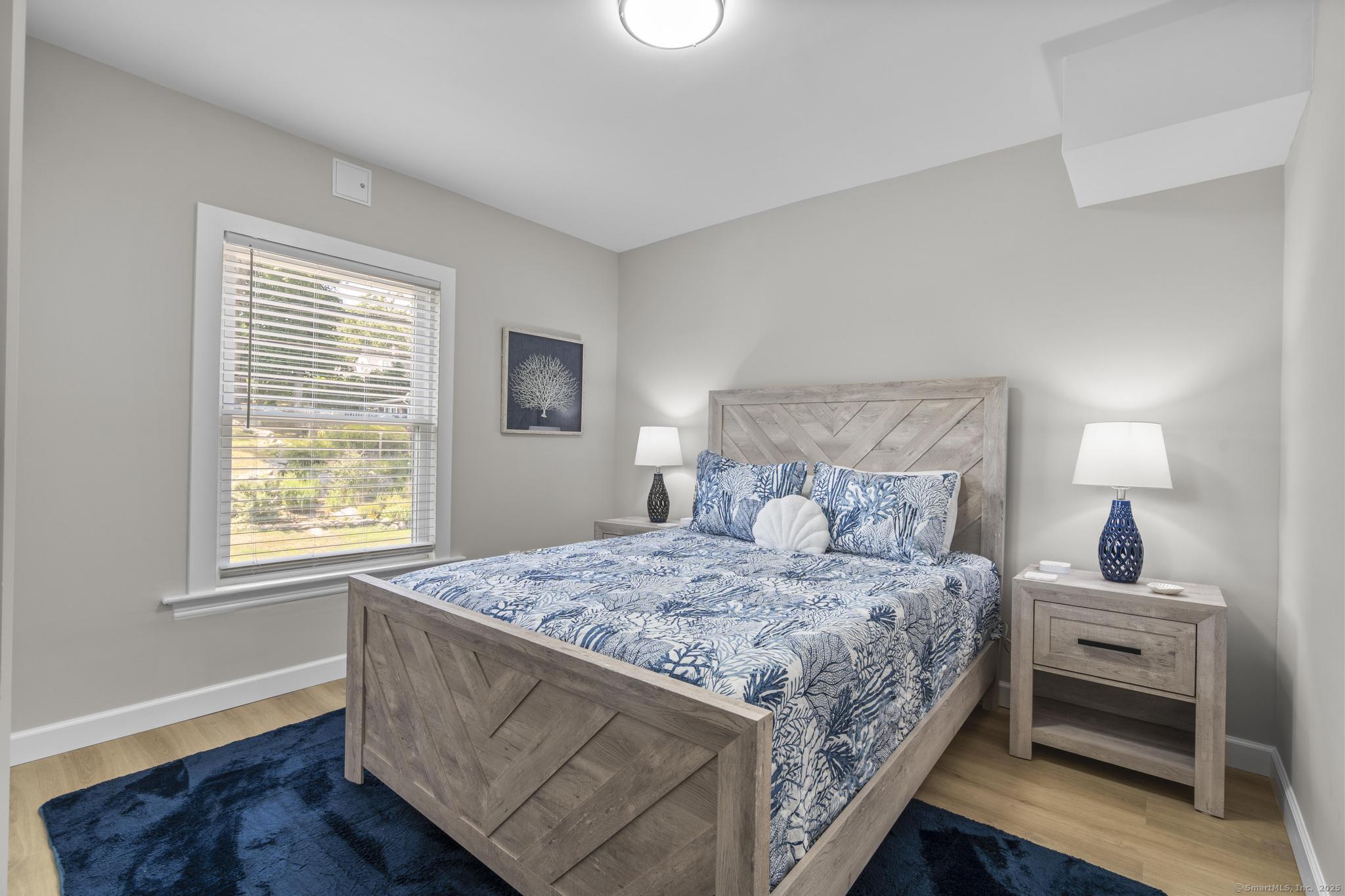 270 Elm Street, Unit 2 Groton, CT 06340 - Photo 13 of 36 a bedroom with a bed and a window