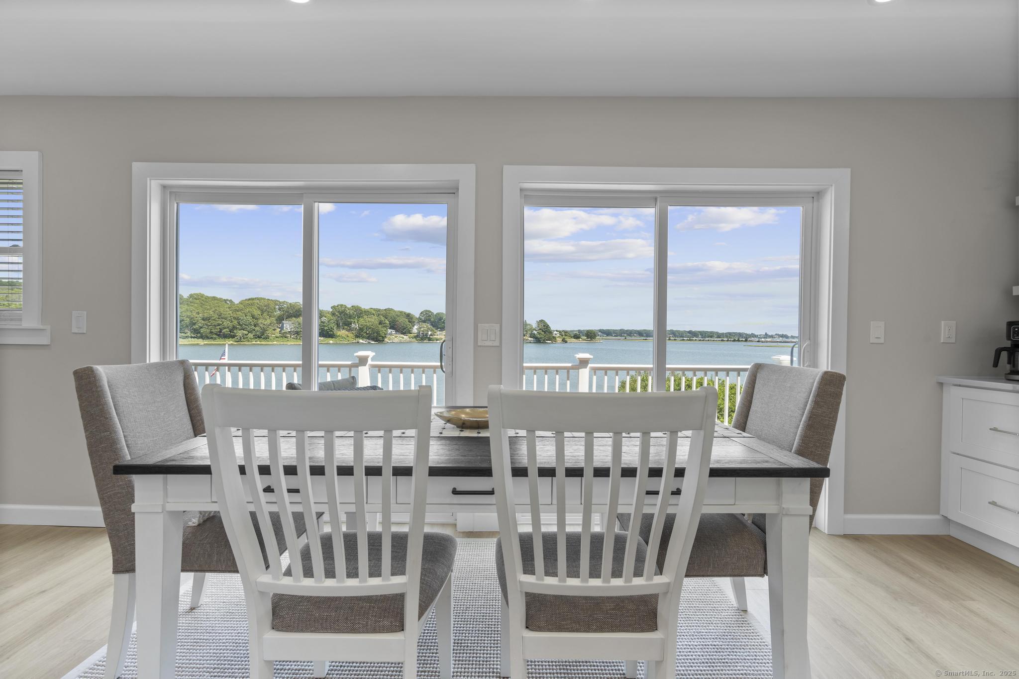 270 Elm Street, Unit 2 Groton, CT 06340 - Photo 18 of 36 a view of a city from a dining room with furniture window and wooden floor