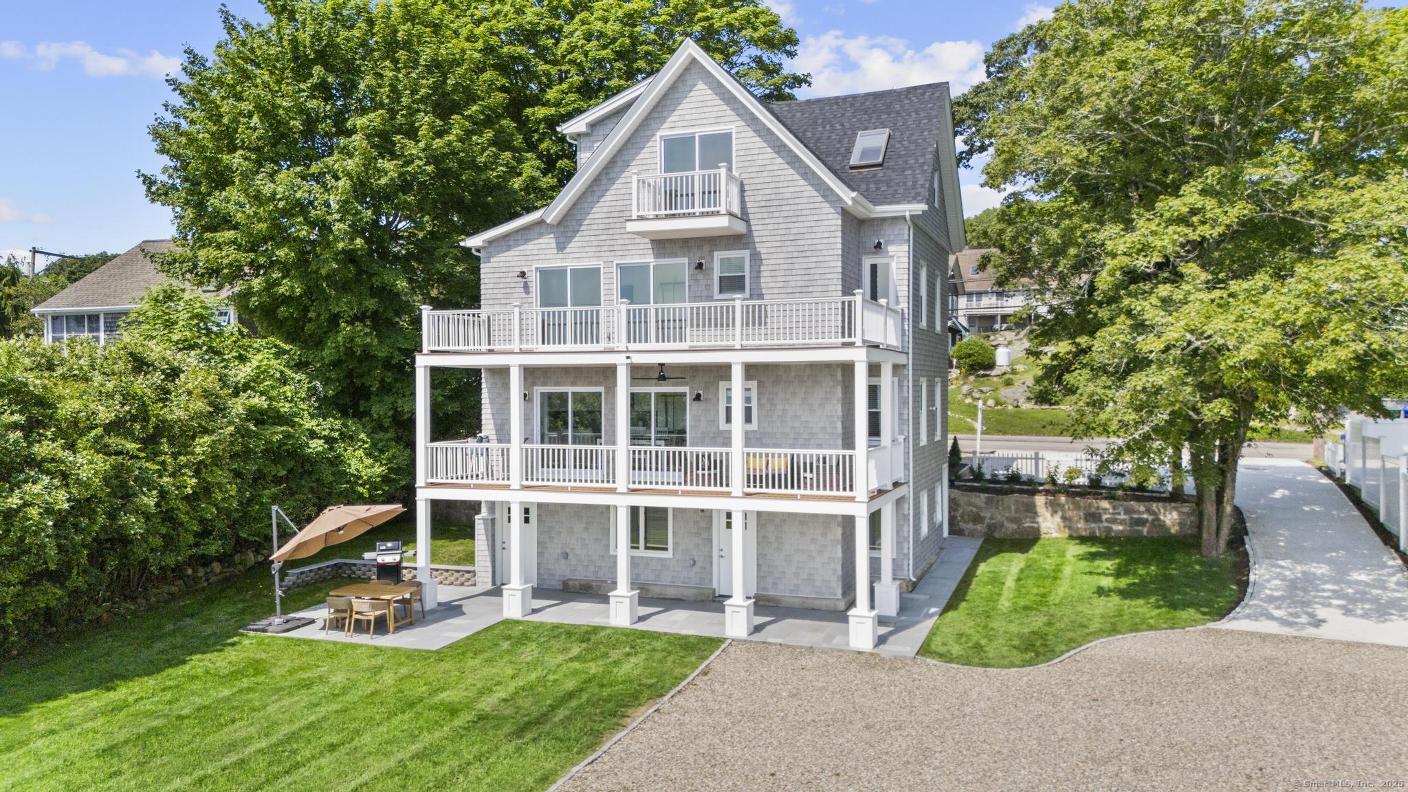 270 Elm Street, Unit 2 Groton, CT 06340 - Photo 2 of 36 a view of a house with a yard and sitting area