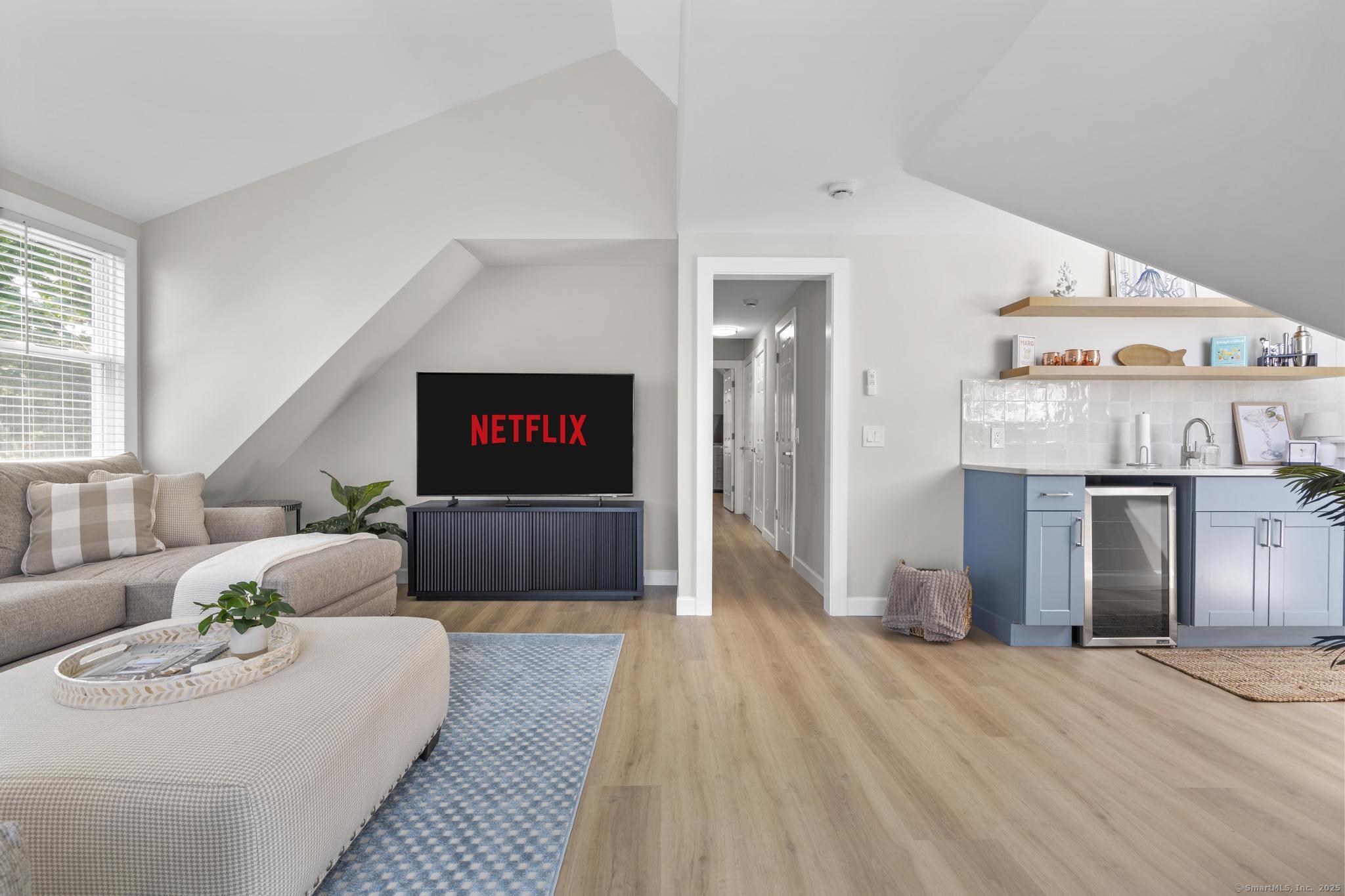 270 Elm Street, Unit 2 Groton, CT 06340 - Photo 27 of 36 a living room with furniture and a flat screen tv