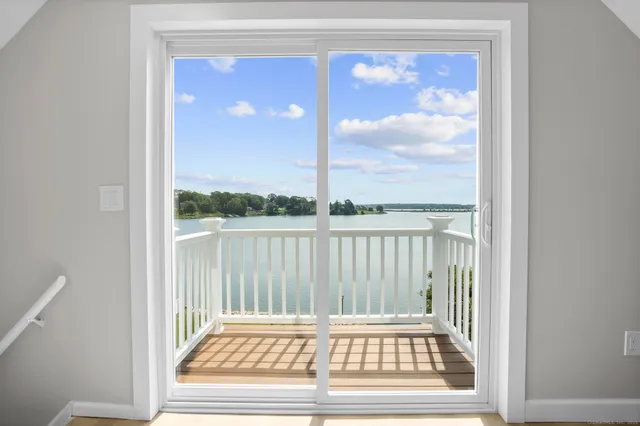 a view of a lake with houses in the back