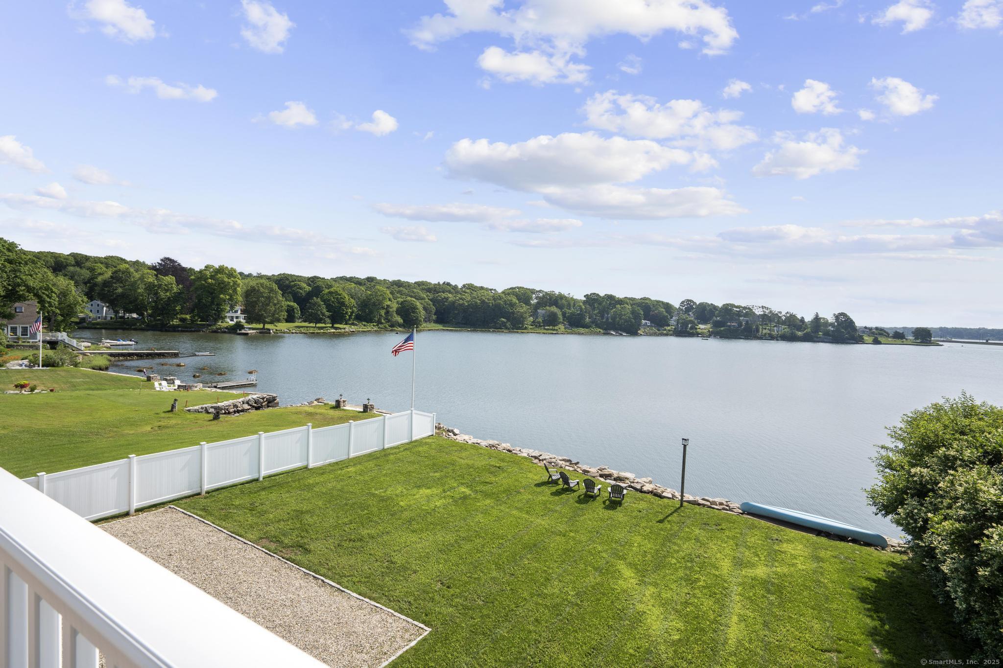 270 Elm Street, Unit 2 Groton, CT 06340 - Photo 30 of 36 a view of a lake with houses in the back
