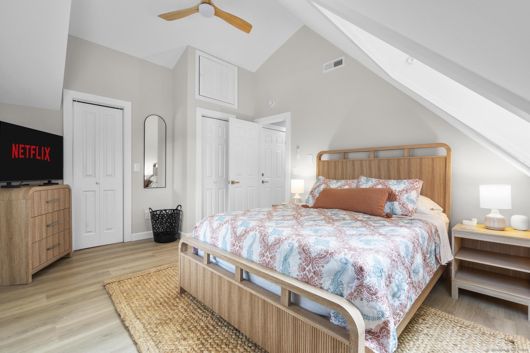 270 Elm Street, Unit 2 Groton, CT 06340 - Photo 35 of 36 a bedroom with a bed and a flat screen tv