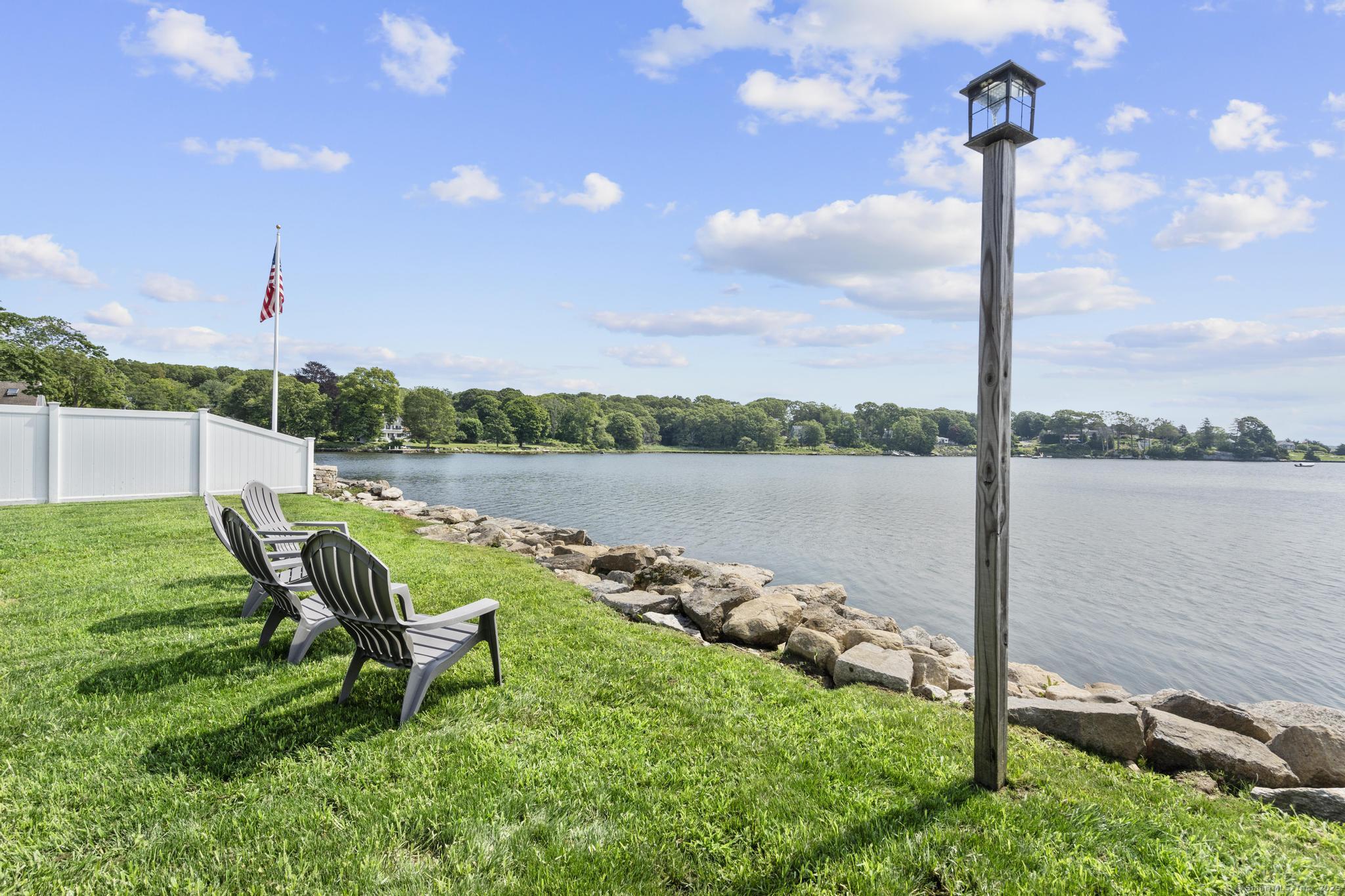 270 Elm Street, Unit 2 Groton, CT 06340 - Photo 5 of 36 a view of a lake with couches in the back yard