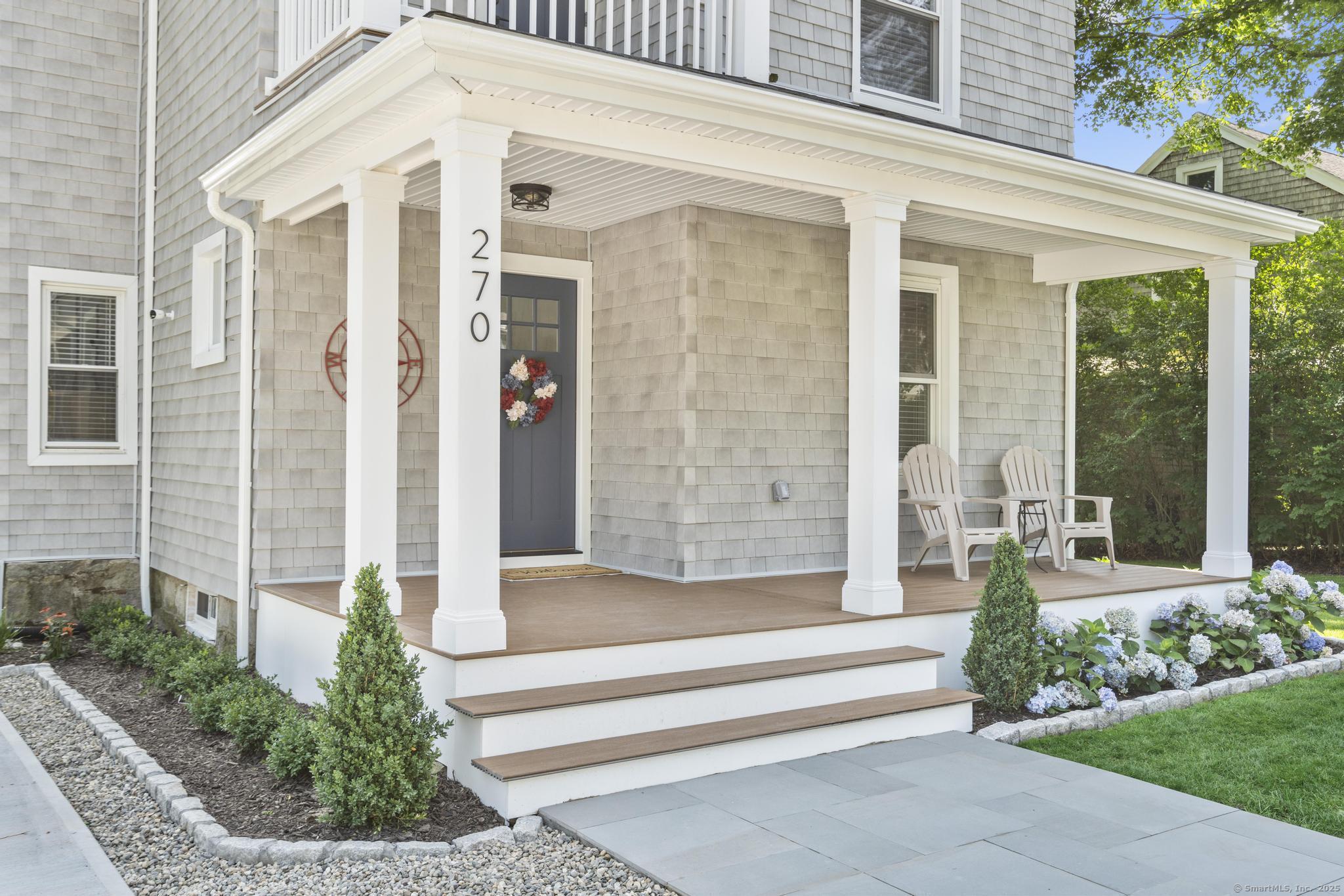 270 Elm Street, Unit 2 Groton, CT 06340 - Photo 7 of 36 a front view of a house with a garden and plants