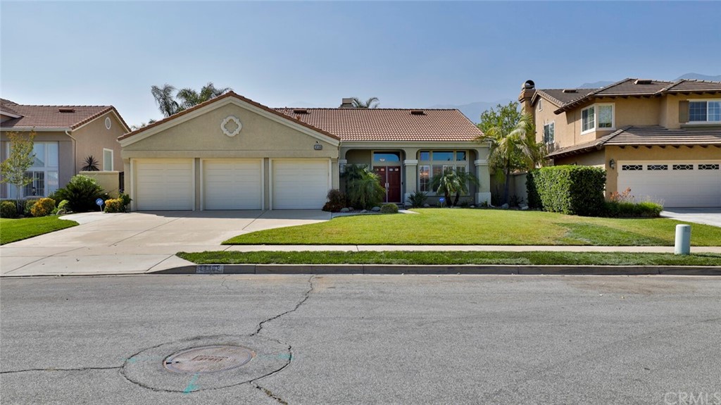 14108 Arcadia Way Rancho Cucamonga, CA 91739 - Photo 1 of 1 a view of white house with a big yard and potted plants