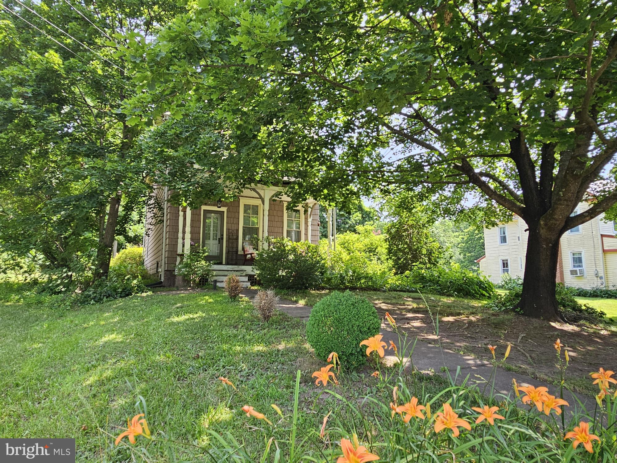 9039 Easton Road Ottsville, PA 18942 - Photo 55 of 61 a view of a garden with a tree