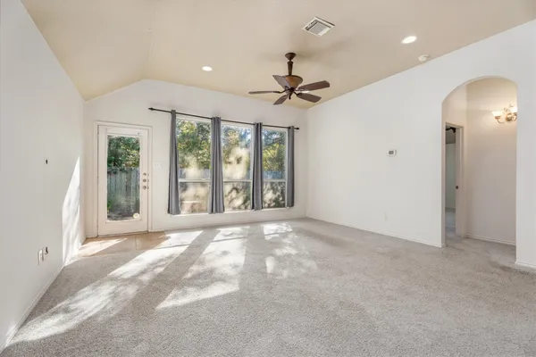 a kitchen with stainless steel appliances granite countertop a refrigerator sink and cabinets