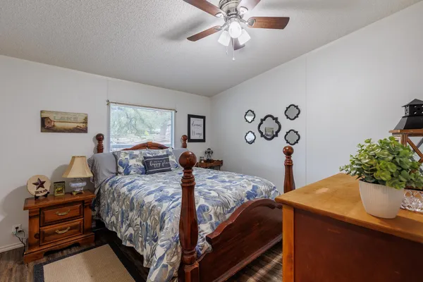 a bedroom with a bed and a dresser