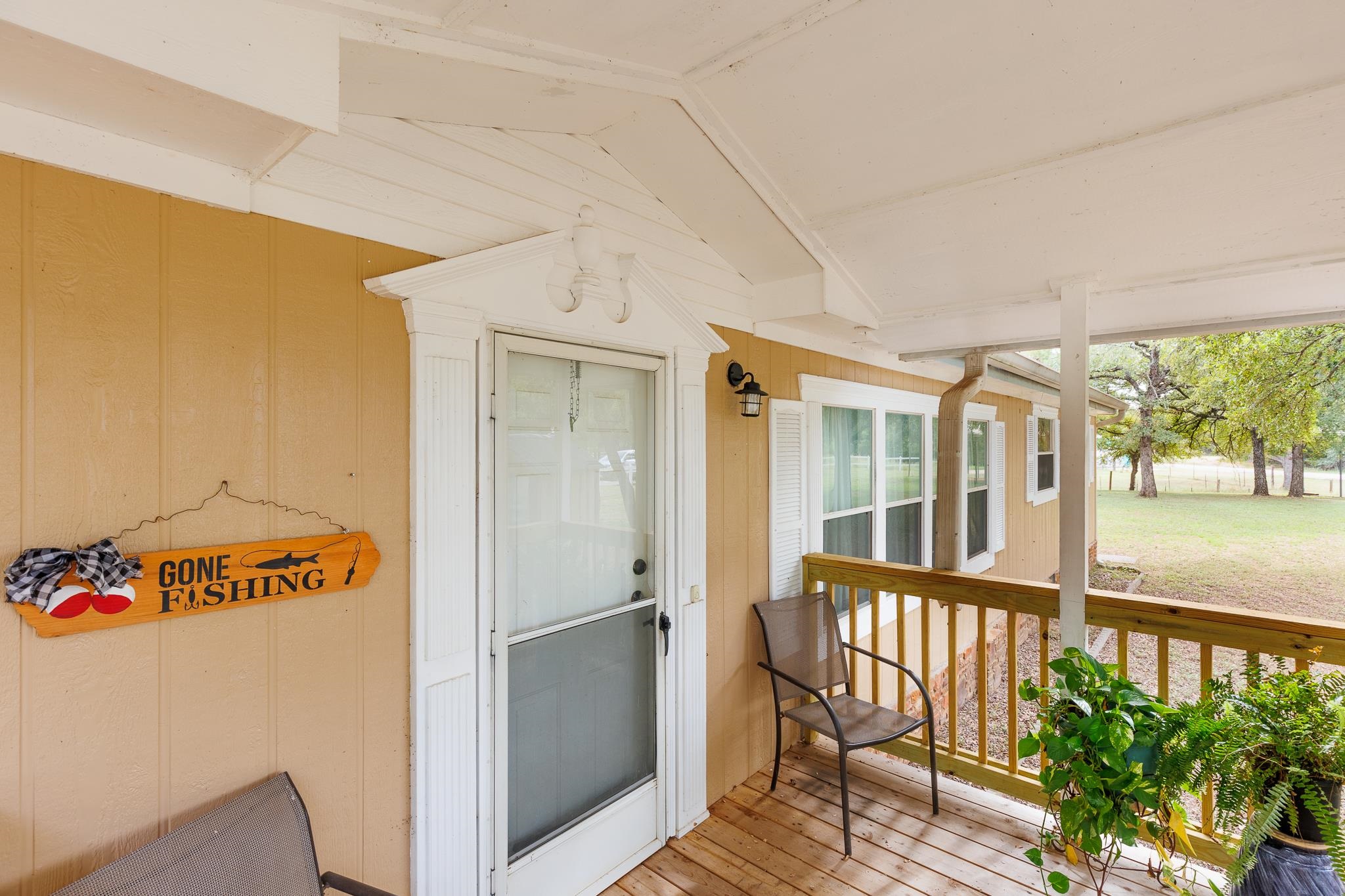 200 Munson Tow, TX 78672 - Photo 3 of 29 a view of a porch with furniture and garden