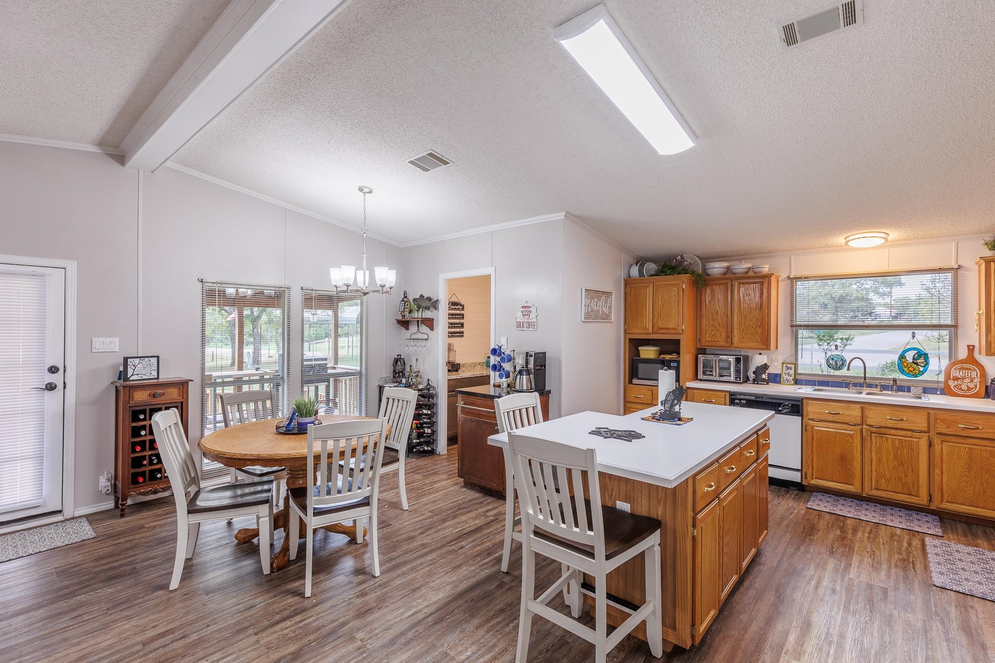 200 Munson Tow, TX 78672 - Photo 7 of 29 a view of a dining room with furniture window and wooden floor