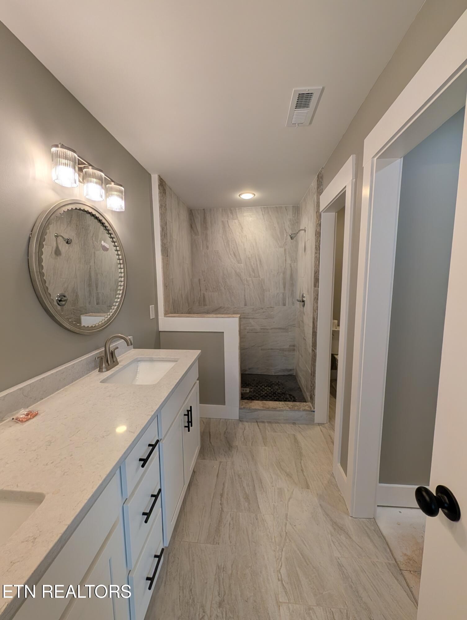 144 Abbott Road Lenoir City, TN 37771 - Photo 11 of 24 a bathroom with a sink and a mirror