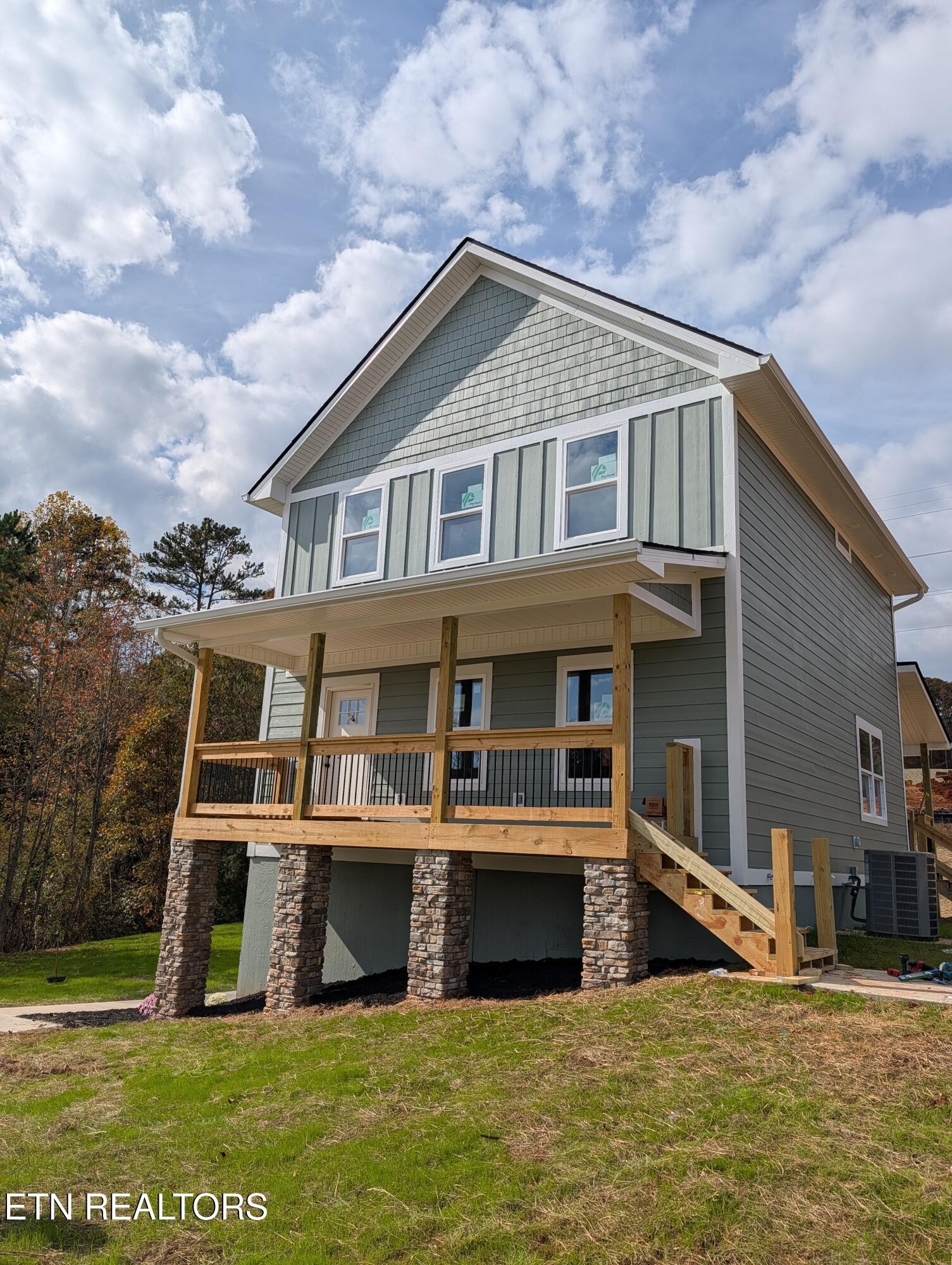 144 Abbott Road Lenoir City, TN 37771 - Photo 2 of 24 a large white building with a white roof