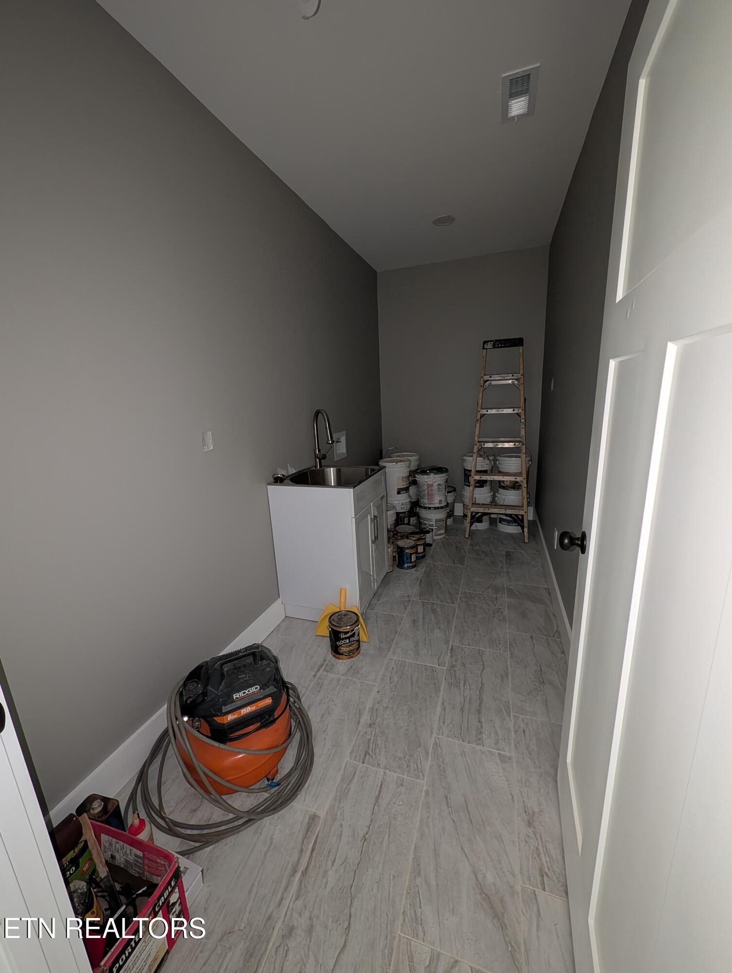 144 Abbott Road Lenoir City, TN 37771 - Photo 21 of 24 a room with furniture and a wooden floor