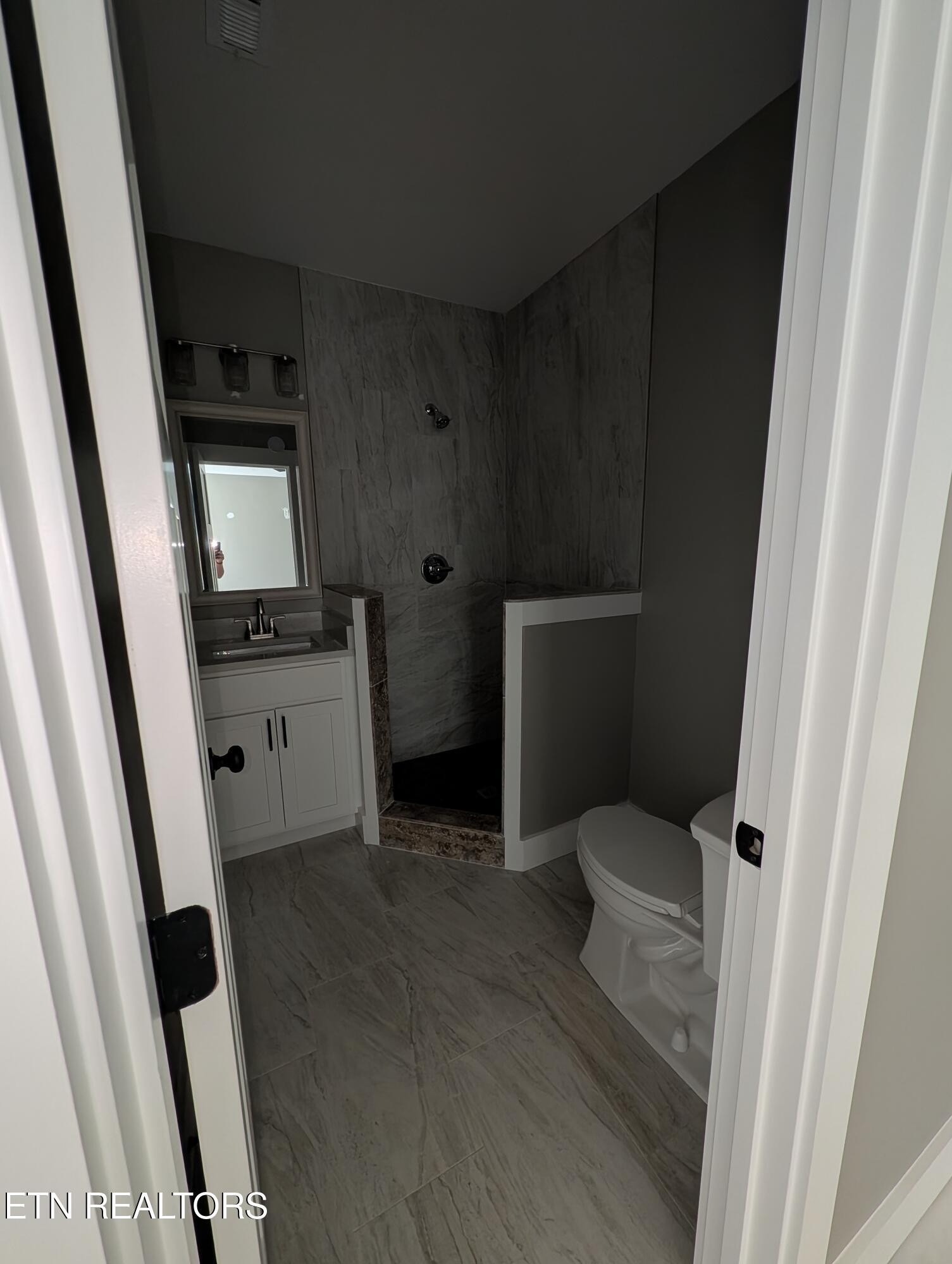 144 Abbott Road Lenoir City, TN 37771 - Photo 22 of 24 a bathroom with a sink toilet and shower