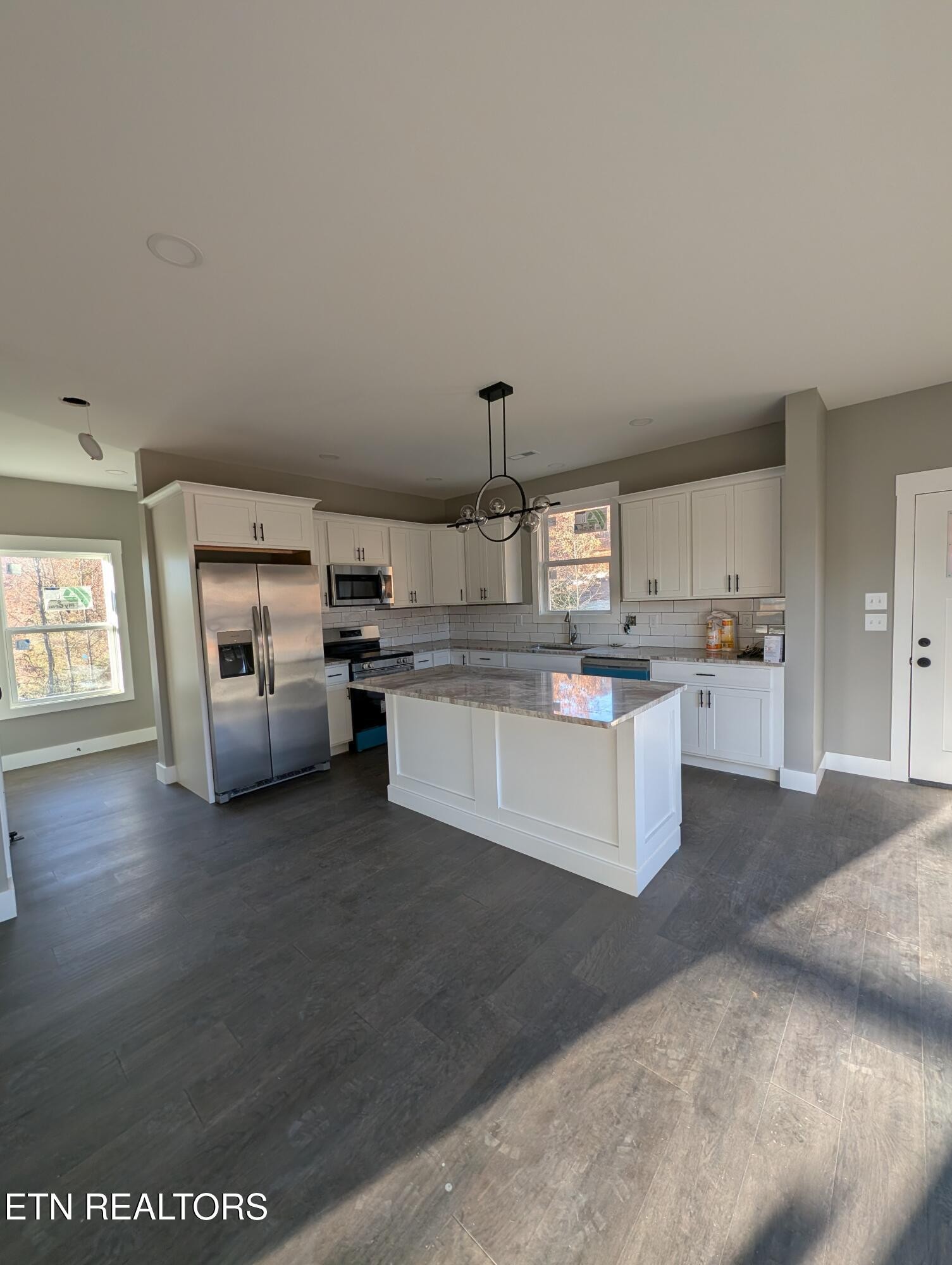 144 Abbott Road Lenoir City, TN 37771 - Photo 3 of 24 a large kitchen with cabinets and a wooden floor