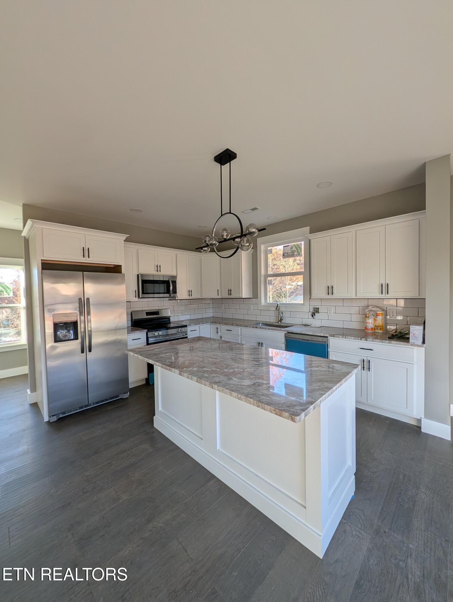144 Abbott Road Lenoir City, TN 37771 - Photo 4 of 24 a kitchen with kitchen island granite countertop lots of counter top space