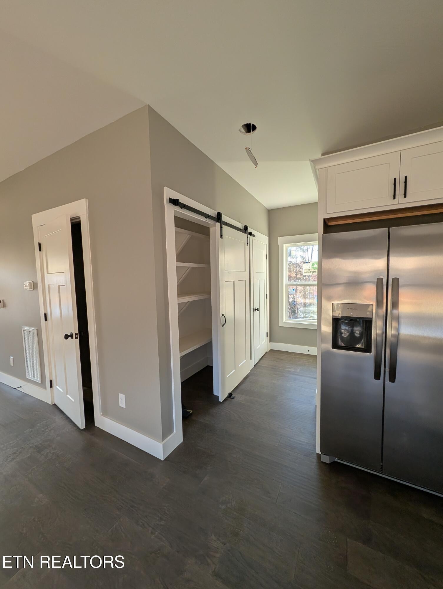 144 Abbott Road Lenoir City, TN 37771 - Photo 6 of 24 a view of a kitchen with a refrigerator cabinet and a dishwasher dryer