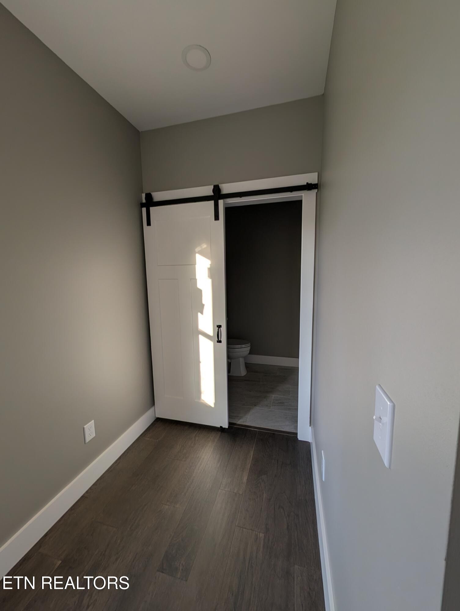 144 Abbott Road Lenoir City, TN 37771 - Photo 7 of 24 a view of a room with wooden floor and closet