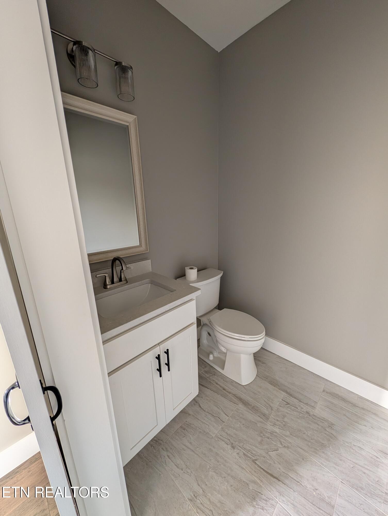 144 Abbott Road Lenoir City, TN 37771 - Photo 8 of 24 a bathroom with a sink and a toilet