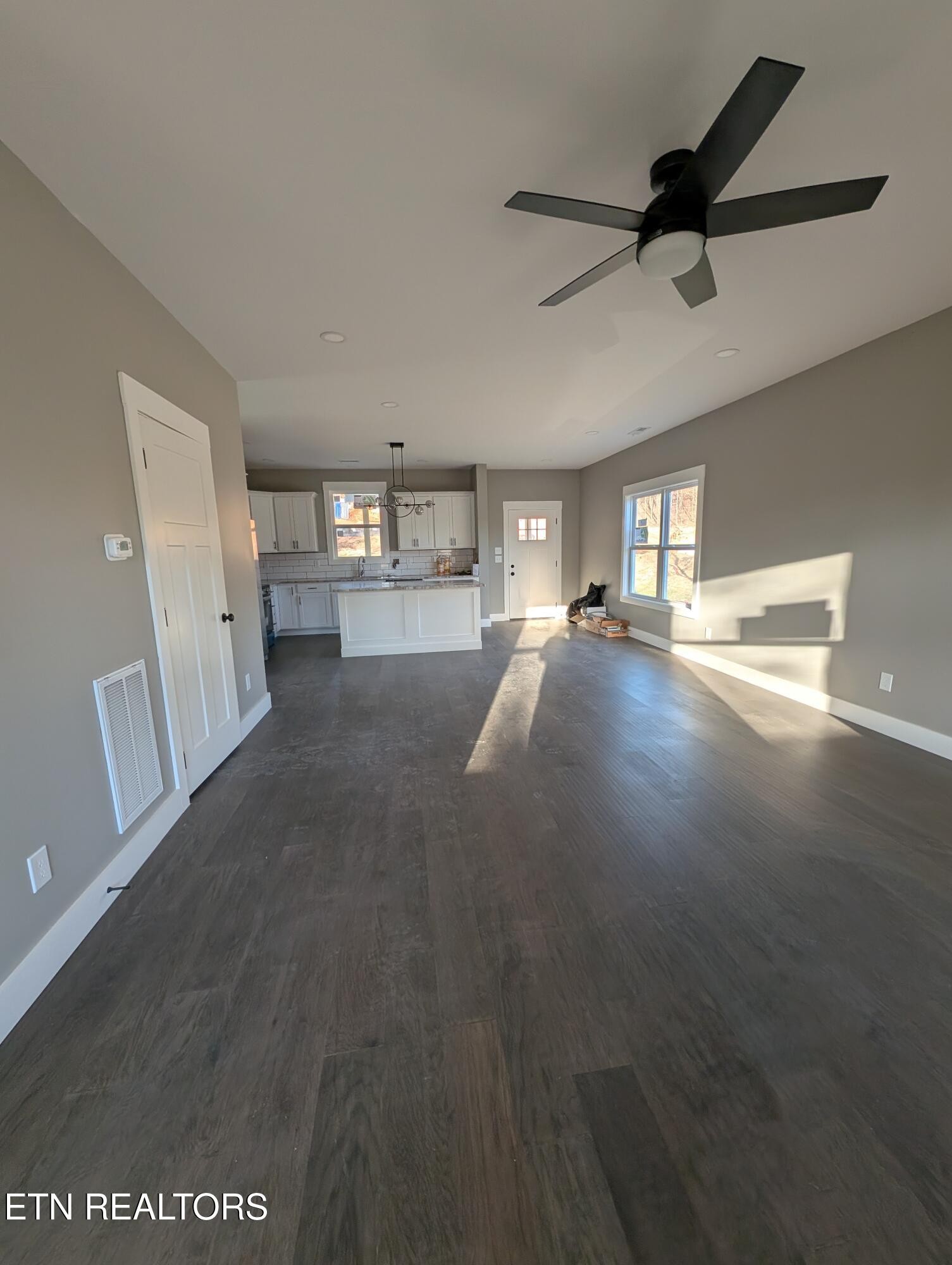144 Abbott Road Lenoir City, TN 37771 - Photo 9 of 24 a view of empty room with wooden floor and fan