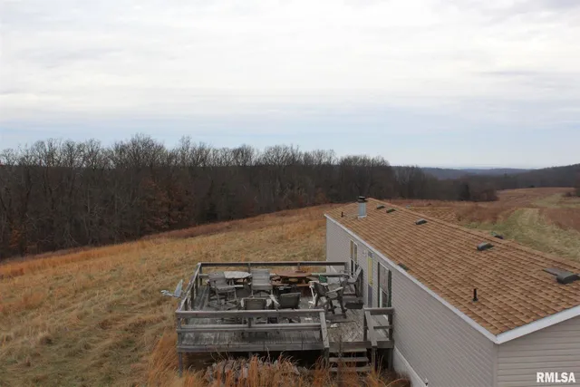 a view of a balcony with wooden floor