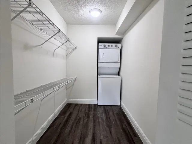 a view of storage and utility room with racks on the wall