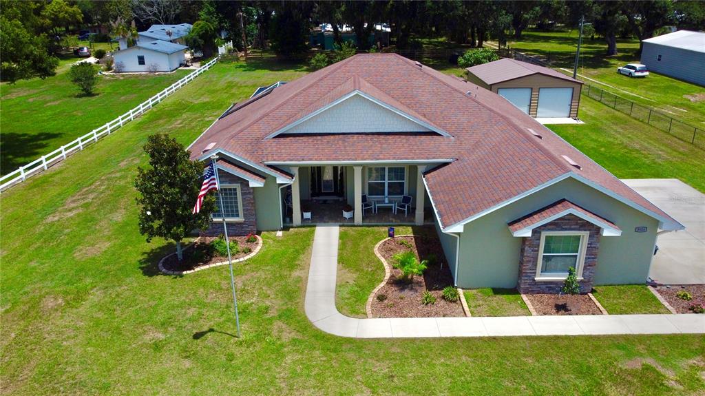 3934 Connersville Road Bartow, FL 33830 - Photo 64 of 81 a view of house with garden and a swimming pool