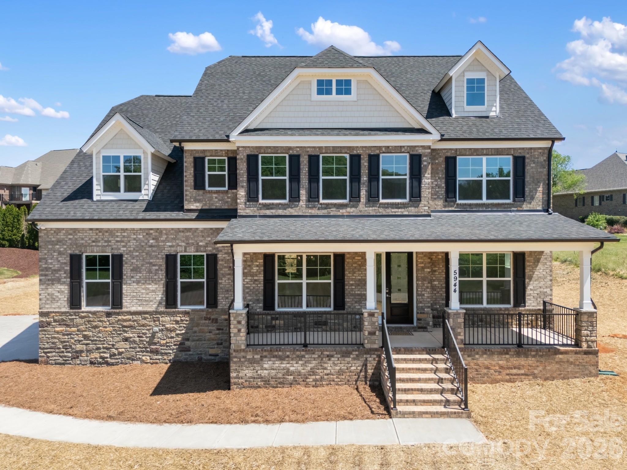 5944 Bakers Point Hickory, NC 28602 - Photo 1 of 39 a front view of a house with garden