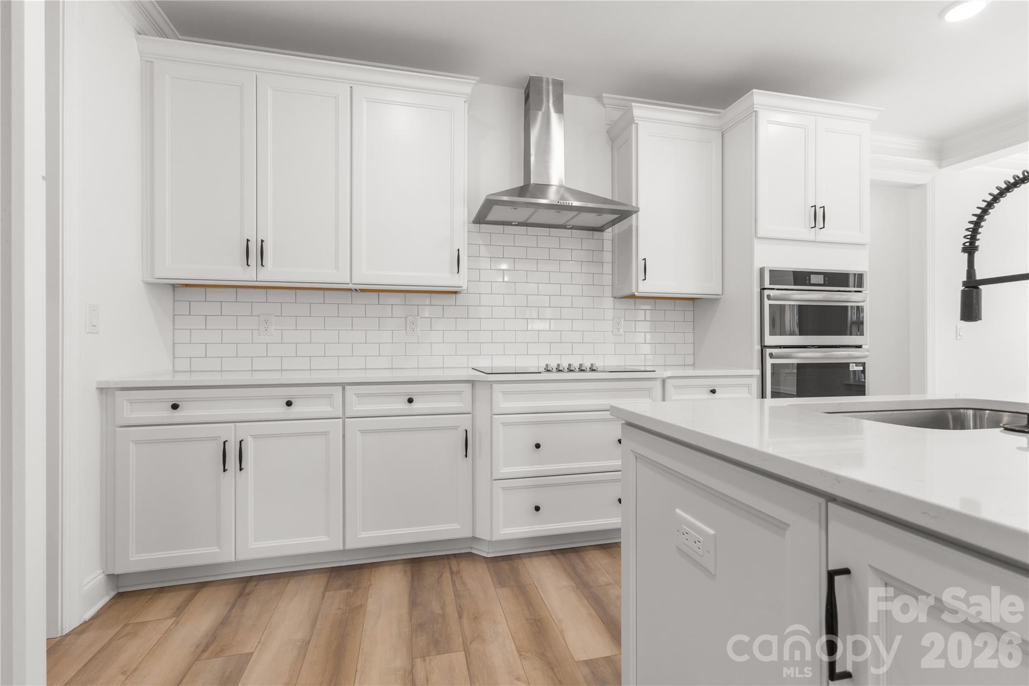 5944 Bakers Point Hickory, NC 28602 - Photo 13 of 39 a kitchen with stainless steel appliances white cabinets and a sink