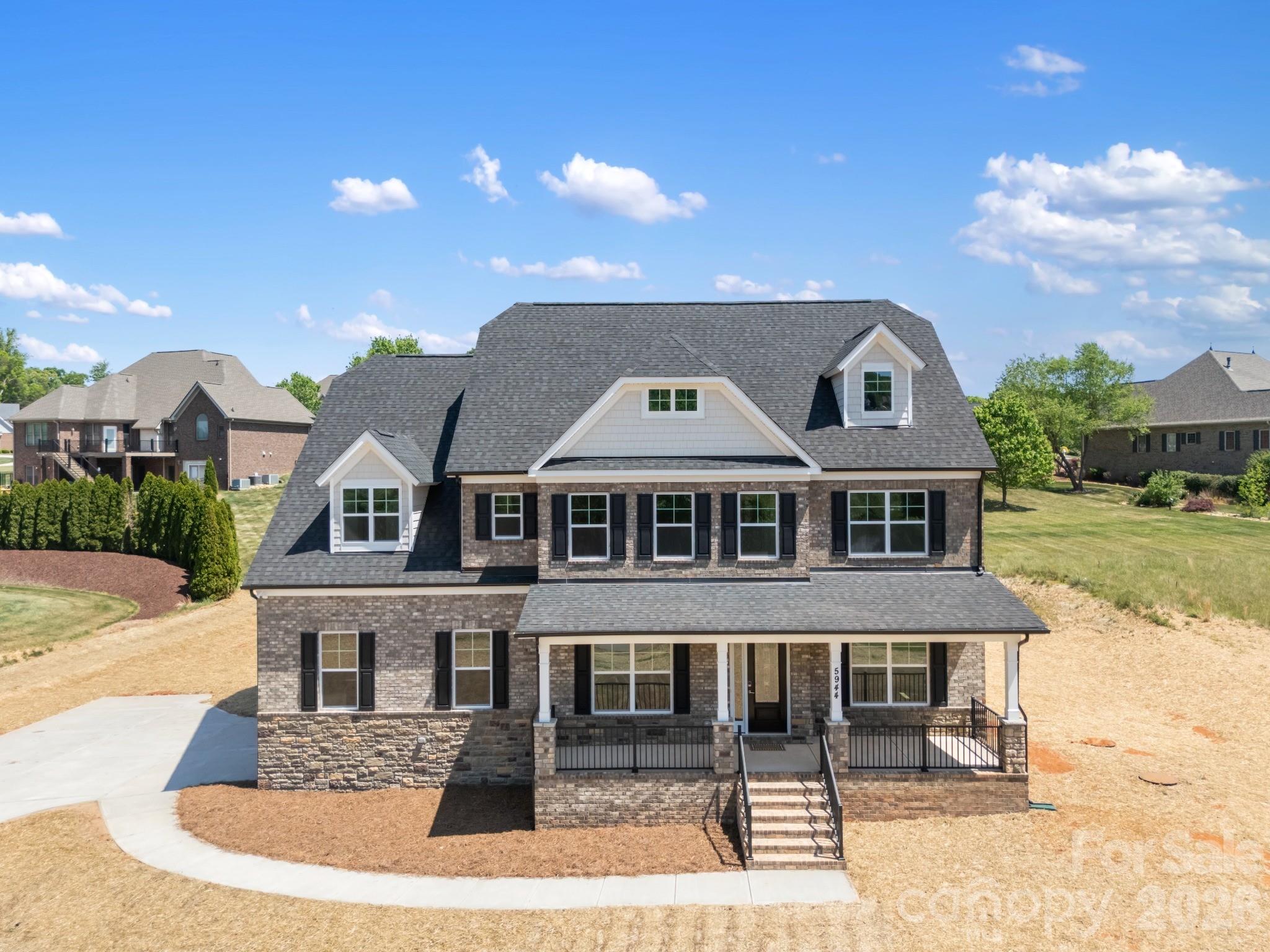 5944 Bakers Point Hickory, NC 28602 - Photo 2 of 39 a front view of a house with garden