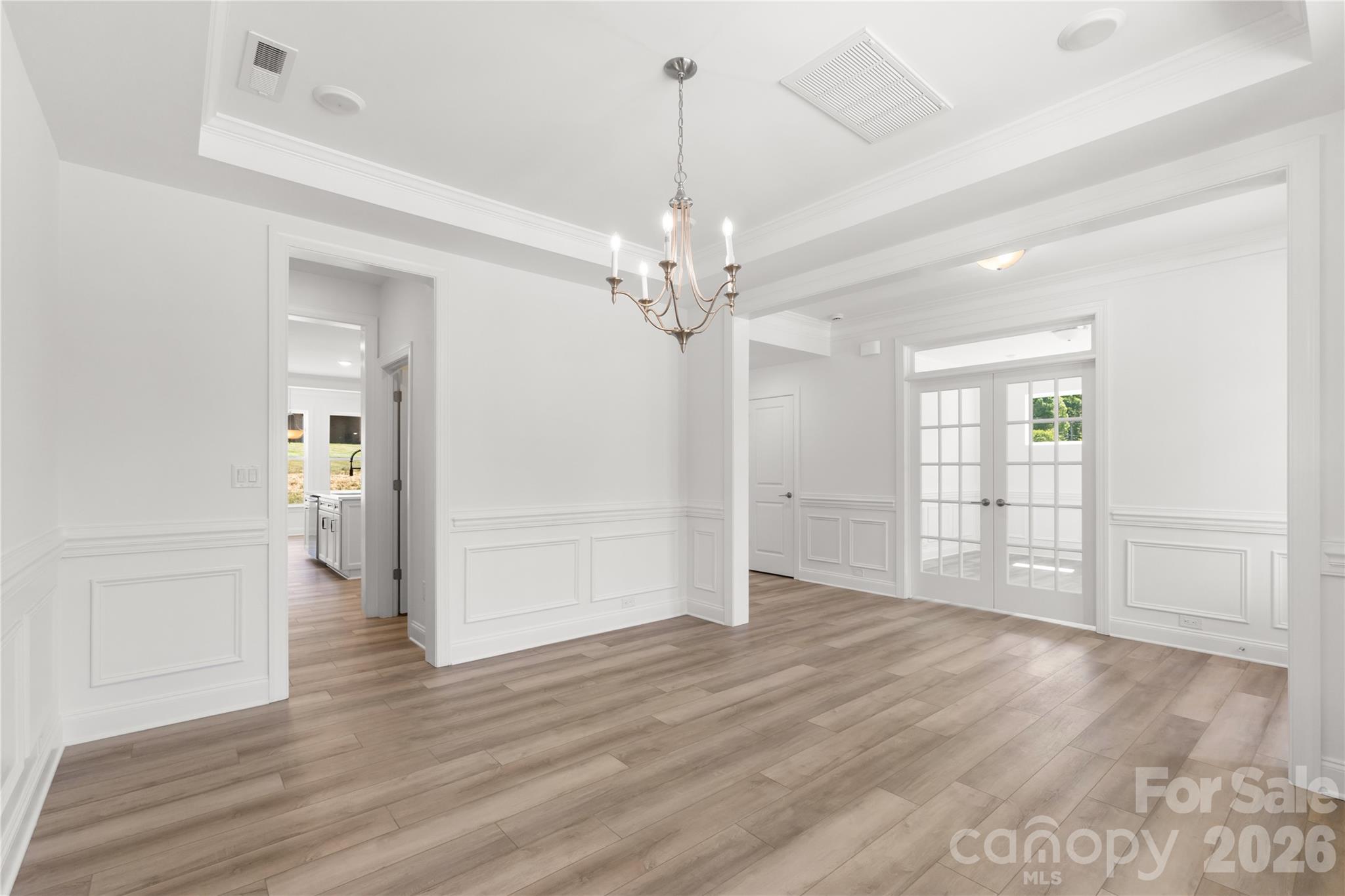 5944 Bakers Point Hickory, NC 28602 - Photo 21 of 39 wooden floor in an empty room with a mirror