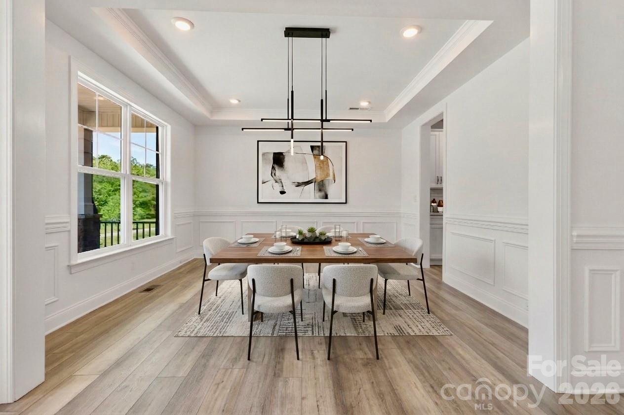 5944 Bakers Point Hickory, NC 28602 - Photo 22 of 39 a view of a dining room with furniture window and wooden floor