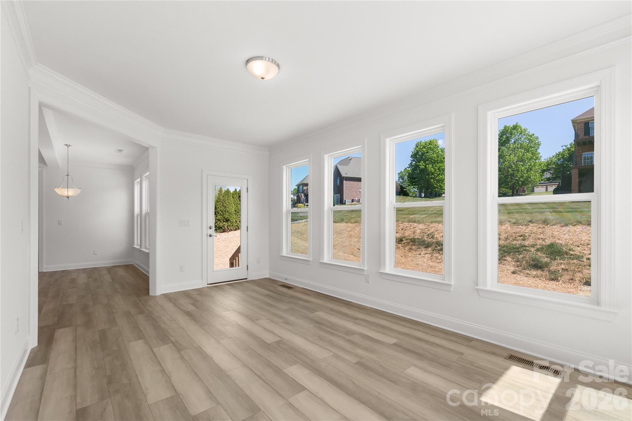 5944 Bakers Point Hickory, NC 28602 - Photo 24 of 39 a view of an empty room with wooden floor and a window
