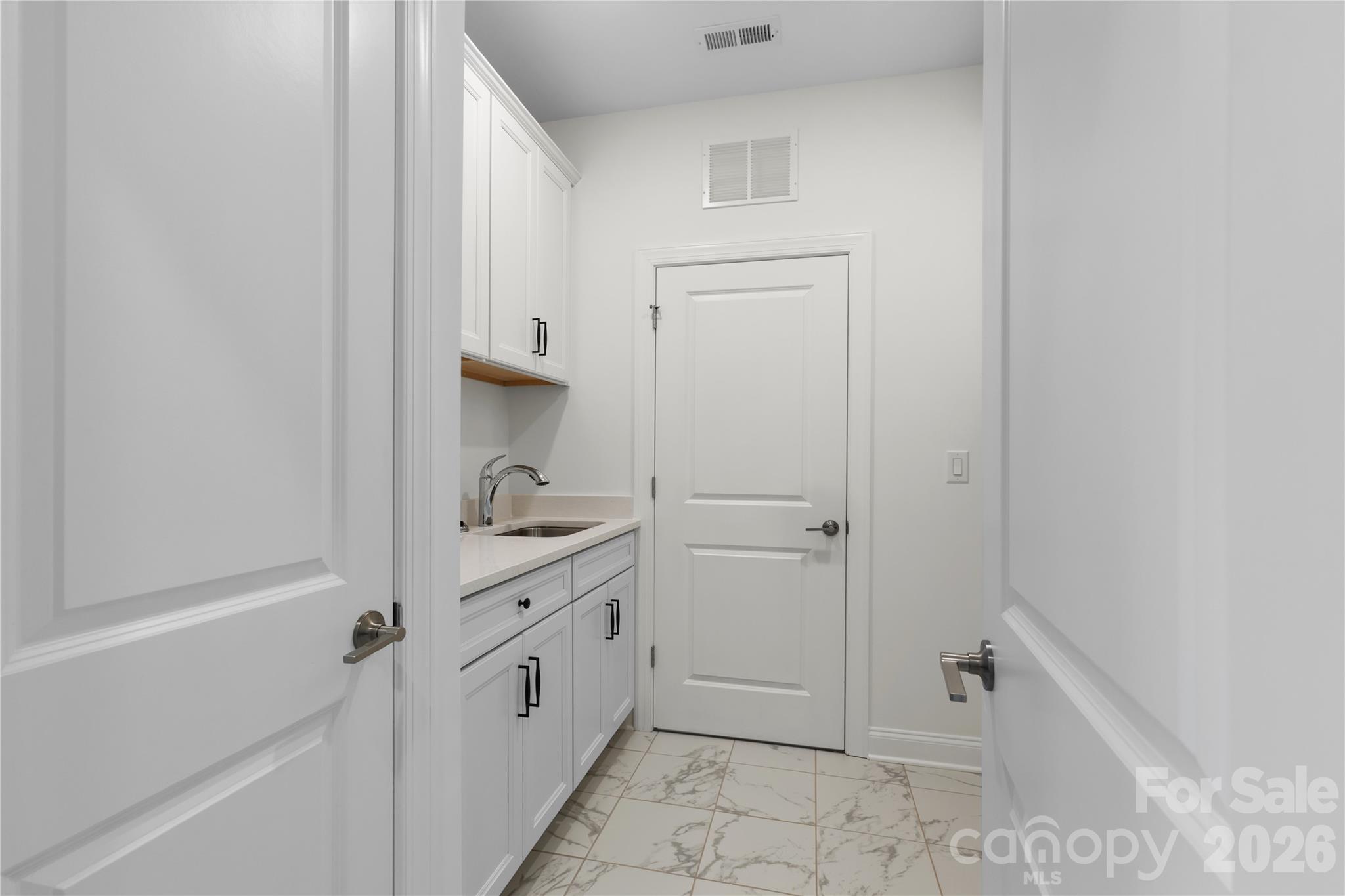 5944 Bakers Point Hickory, NC 28602 - Photo 27 of 39 a bathroom with a double vanity sink and mirror
