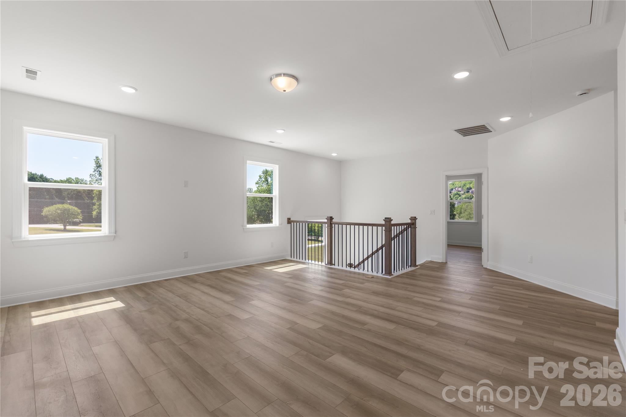 5944 Bakers Point Hickory, NC 28602 - Photo 28 of 39 a view of an empty room with window and wooden floor