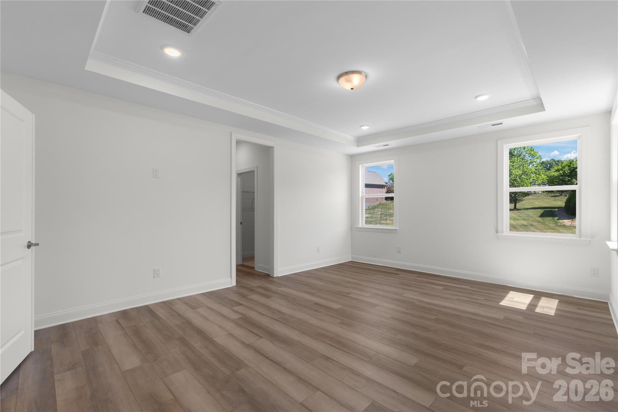 5944 Bakers Point Hickory, NC 28602 - Photo 30 of 39 a view of an empty room with wooden floor and a window