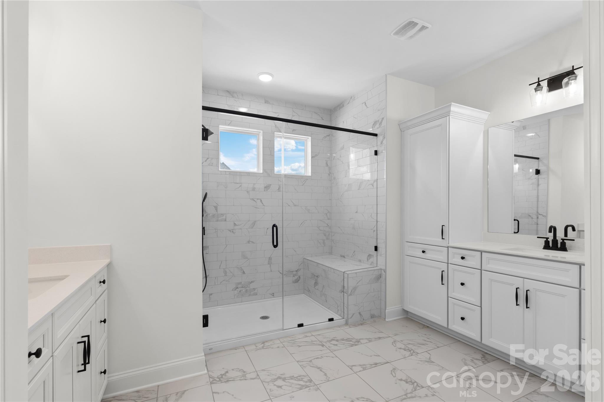 5944 Bakers Point Hickory, NC 28602 - Photo 32 of 39 a bathroom with a shower sink and mirror