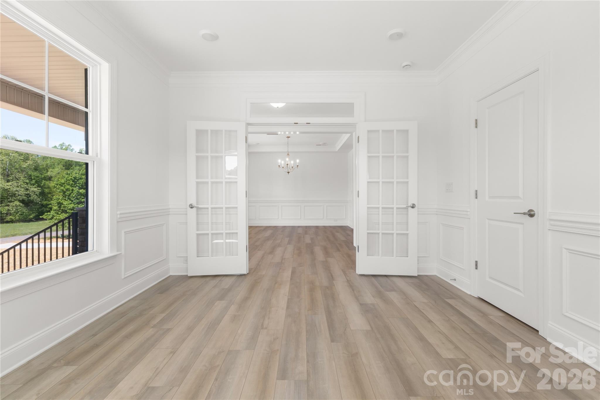 5944 Bakers Point Hickory, NC 28602 - Photo 34 of 39 a view of a room with wooden floor and white walls