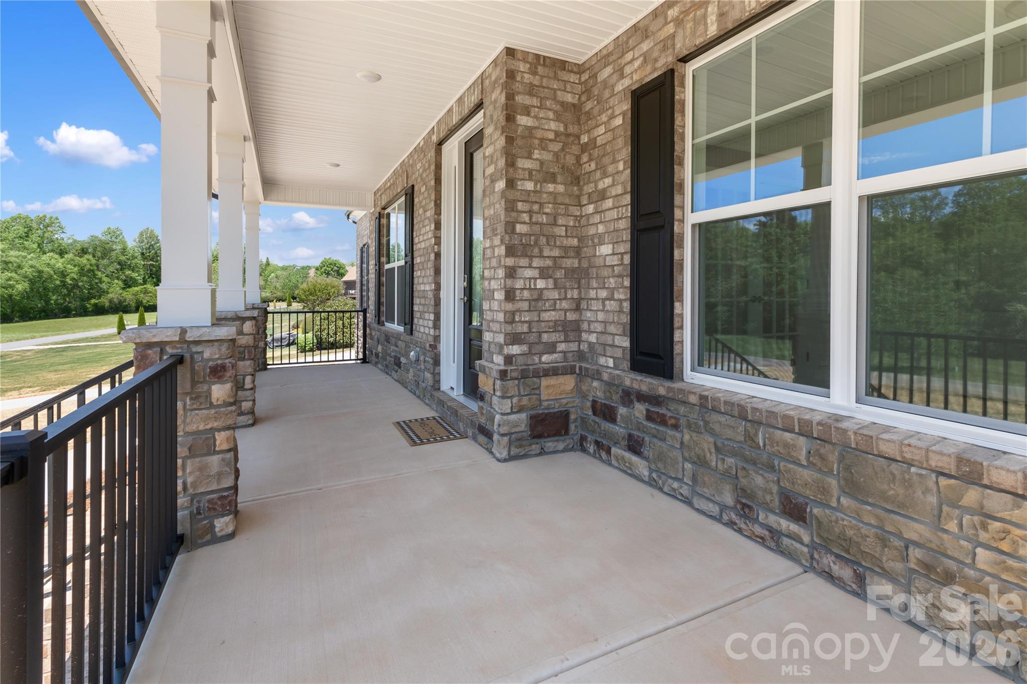 5944 Bakers Point Hickory, NC 28602 - Photo 5 of 39 a view of a balcony with chairs and table in the patio
